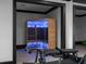 Home gym featuring a wooden sauna with blue lighting and exercise equipment at 4100 Oak Hill Rd, Douglasville, GA 30135