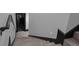 Stairway has carpet-free steps, a handrail, and modern lighting on the painted walls at 4100 Oak Hill Rd, Douglasville, GA 30135