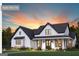 Charming single-story farmhouse with a welcoming front porch and professionally landscaped yard at 3841 Maggie Se Ct, Conyers, GA 30013