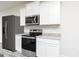 Kitchen featuring stainless steel appliances, granite countertops, and white cabinetry at 289 Limestone Circle, Conyers, GA 30013