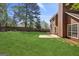 Well-kept backyard featuring a patio, lush green grass, and a wooden fence at 848 Gateshead Ct, Lawrenceville, GA 30043
