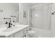 White bathroom featuring a vanity, framed mirror, bath tub with shower, and commode at 848 Gateshead Ct, Lawrenceville, GA 30043
