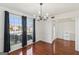 Bright dining room with hardwood floors and a view of the neighborhood through large windows at 848 Gateshead Ct, Lawrenceville, GA 30043