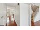 Bright foyer featuring hardwood floors, staircase, and views into adjacent living spaces at 848 Gateshead Ct, Lawrenceville, GA 30043