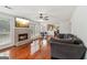 Open living space with brick fireplace, hardwood floors, and windows that bring in natural light at 848 Gateshead Ct, Lawrenceville, GA 30043