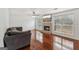 Cozy living room featuring hardwood floors, a brick fireplace, and ample natural light at 848 Gateshead Ct, Lawrenceville, GA 30043