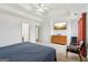 Large main bedroom with tray ceiling, ceiling fan, dresser, and a television mounted on the wall at 848 Gateshead Ct, Lawrenceville, GA 30043