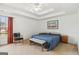 Spacious main bedroom with a tray ceiling, carpet, and large windows for natural lighting at 848 Gateshead Ct, Lawrenceville, GA 30043