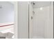 A close up of a white fiberglass shower stall with chrome shower head at 848 Gateshead Ct, Lawrenceville, GA 30043