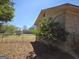 View of the house from the fenced backyard, showcasing the brick exterior of the home at 216 E Richardson St, Oxford, GA 30054