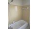 Full bathtub and shower featuring tile walls and flooring at 216 E Richardson St, Oxford, GA 30054