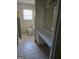 Bathroom with vanity, toilet, tile flooring, and bright natural light at 216 E Richardson St, Oxford, GA 30054