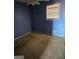 Bedroom with wall to wall carpet flooring, neutral colors and bright light from window at 216 E Richardson St, Oxford, GA 30054