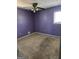Bedroom with neutral colors and a ceiling fan at 216 E Richardson St, Oxford, GA 30054