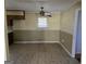 Eat-in kitchen featuring tile flooring, a ceiling fan, and a window for natural light at 216 E Richardson St, Oxford, GA 30054