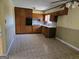 Eat-in kitchen features wood cabinets, tile floors, and a neutral color palette at 216 E Richardson St, Oxford, GA 30054
