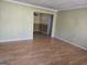 Open living room featuring hardwood floors and neutral color palette at 216 E Richardson St, Oxford, GA 30054