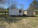 Exterior image of two storage sheds on the property, perfect for storing tools and equipment at 216 E Richardson St, Oxford, GA 30054