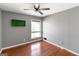 Cozy bedroom with natural light showcases hardwood floors and a ceiling fan at 40 Circle Dr, Hampton, GA 30228