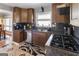 Modern kitchen with stainless steel appliances, granite countertops, and wood cabinetry at 40 Circle Dr, Hampton, GA 30228