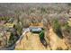 Lovely home with front porch is nestled among the trees at 6365 Mountain View Trl, Cumming, GA 30041