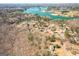 Breathtaking aerial view showcases a waterfront community with lake access and mature trees at 6365 Mountain View Trl, Cumming, GA 30041
