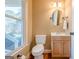 Bright half bathroom showcasing hardwood floors, and a pedestal sink at 6365 Mountain View Trl, Cumming, GA 30041