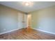 Neutral bedroom with hardwood floors, closet, and an ensuite entrance at 6365 Mountain View Trl, Cumming, GA 30041