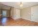 Open dining area features hardwood floors, natural light, and is open to other rooms at 6365 Mountain View Trl, Cumming, GA 30041