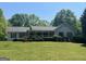 Charming single-story home featuring a welcoming front porch and well-maintained landscaping at 6365 Mountain View Trl, Cumming, GA 30041