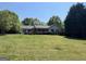 Lovely single-story house with a spacious lawn, complemented by mature trees for added privacy at 6365 Mountain View Trl, Cumming, GA 30041
