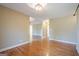 A large empty room with hardwood floors at 6365 Mountain View Trl, Cumming, GA 30041