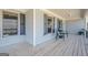 Inviting covered front porch featuring neutral siding and painted trim at 6365 Mountain View Trl, Cumming, GA 30041