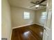 Cozy bedroom featuring hardwood floors and ample natural light at 9184 Thrash Sw St, Covington, GA 30014