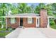 Charming brick home featuring gray shutters and a chimney at 9184 Thrash Sw St, Covington, GA 30014