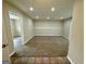 Spacious finished basement with carpet flooring, base molding, and recessed lighting at 2232 Ramblewood Ne Cir, Decatur, GA 30035
