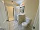Bathroom featuring a stand-up shower, toilet and a vanity with mirror at 2232 Ramblewood Ne Cir, Decatur, GA 30035