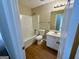 Bright bathroom featuring a tub/shower combination, white vanity, and updated fixtures at 2232 Ramblewood Ne Cir, Decatur, GA 30035