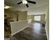 Inviting open-concept living room with hardwood floors, fireplace, and seamless transition to the kitchen at 2232 Ramblewood Ne Cir, Decatur, GA 30035