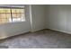 Bedroom with neutral carpet and a large window for plenty of natural light at 3789 Conley Downs Ln, Decatur, GA 30034