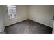 Empty bedroom with neutral carpet and a window for natural light at 3789 Conley Downs Ln, Decatur, GA 30034