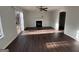 Bright living room featuring hardwood floors and a decorative fireplace at 3789 Conley Downs Ln, Decatur, GA 30034