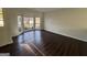 Bright living room featuring hardwood floors and a beautiful bay window at 3789 Conley Downs Ln, Decatur, GA 30034