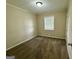 Cozy bedroom with plush carpeting, a window, and a closet for ample storage at 4352 Glenwood Pkwy, Decatur, GA 30032