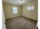 Comfortable bedroom featuring a window and neutral-toned walls and carpet for a soothing atmosphere at 4352 Glenwood Pkwy, Decatur, GA 30032