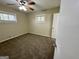Serene bedroom featuring soft carpeting, a window, neutral colors, and a door at 4352 Glenwood Pkwy, Decatur, GA 30032