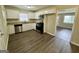 Modern kitchen with stainless steel appliances, white cabinets, and an adjoining living space at 4352 Glenwood Pkwy, Decatur, GA 30032