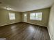 Bright living room featuring wood floors, natural light through the windows, and a welcoming entrance at 4352 Glenwood Pkwy, Decatur, GA 30032