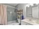Bathroom featuring tile, a shower-tub, vanity and a shelf at 3099 Balearic Se Dr, Marietta, GA 30067