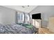 Comfortable bedroom featuring a large window and neutral walls and decor at 3099 Balearic Se Dr, Marietta, GA 30067